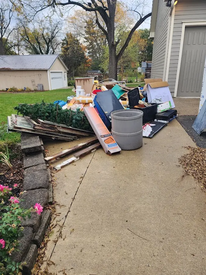 Dumpster being loaded with debris for 30 Yard Dumpster Rental in Pimmit Hills